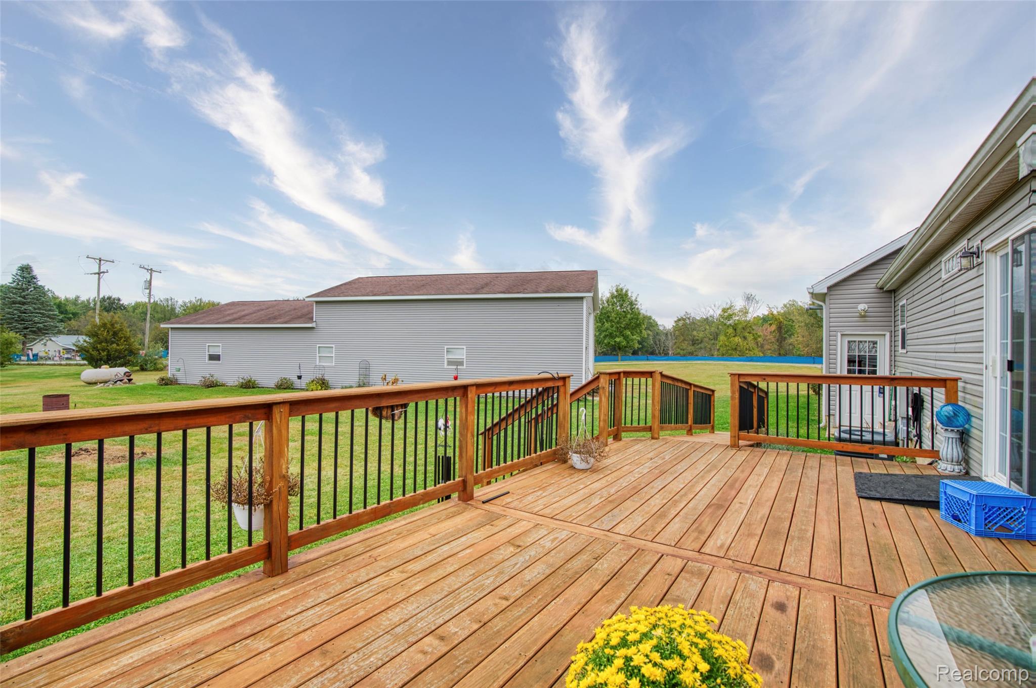 5601 West Lovejoy Road Byron, MI 48418 - Photo 29 of 40 Wooden deck featuring a yard