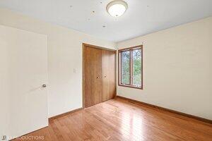 5718 West Small Road La Porte, IN 46350 - Photo 12 of 26 a view of an empty room with wooden floor and a window