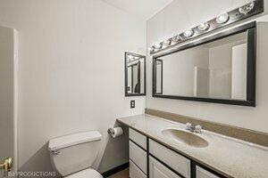 5718 West Small Road La Porte, IN 46350 - Photo 13 of 26 a bathroom with a granite countertop toilet sink and mirror