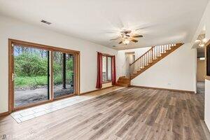 5718 West Small Road La Porte, IN 46350 - Photo 14 of 26 a view of an empty room with glass door and windows