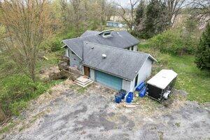 5718 West Small Road La Porte, IN 46350 - Photo 2 of 26 a aerial view of a house with a yard and large tree