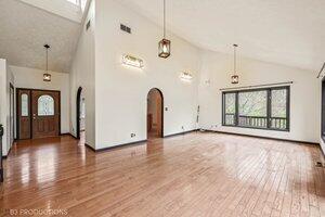 5718 West Small Road La Porte, IN 46350 - Photo 6 of 26 a view of an empty room with window and wooden floor