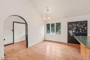 5718 West Small Road La Porte, IN 46350 - Photo 8 of 26 a view of an empty room with window and wooden floor