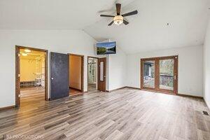 5718 West Small Road La Porte, IN 46350 - Photo 9 of 26 a view of an empty room with wooden floor and a window