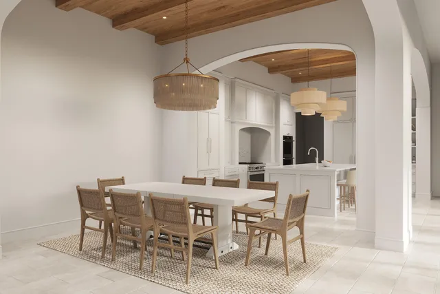 a kitchen with a table chairs refrigerator and microwave