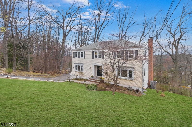 14 Beaver Ridge Road Morris Plains, NJ 07950 - Photo 2 of 39 front view of a house with a yard