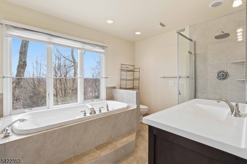 14 Beaver Ridge Road Morris Plains, NJ 07950 - Photo 24 of 39 a bathroom with a bathtub and a sink