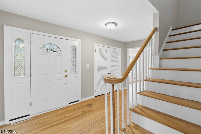 14 Beaver Ridge Road Morris Plains, NJ 07950 - Photo 4 of 39 a view of a hallway with wooden floor and staircase
