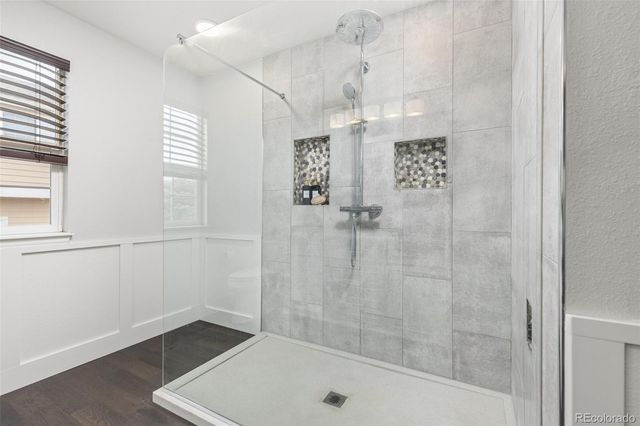a bathroom with a shower and a tub