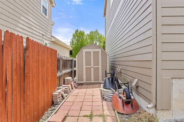 a view of a backyard with a patio