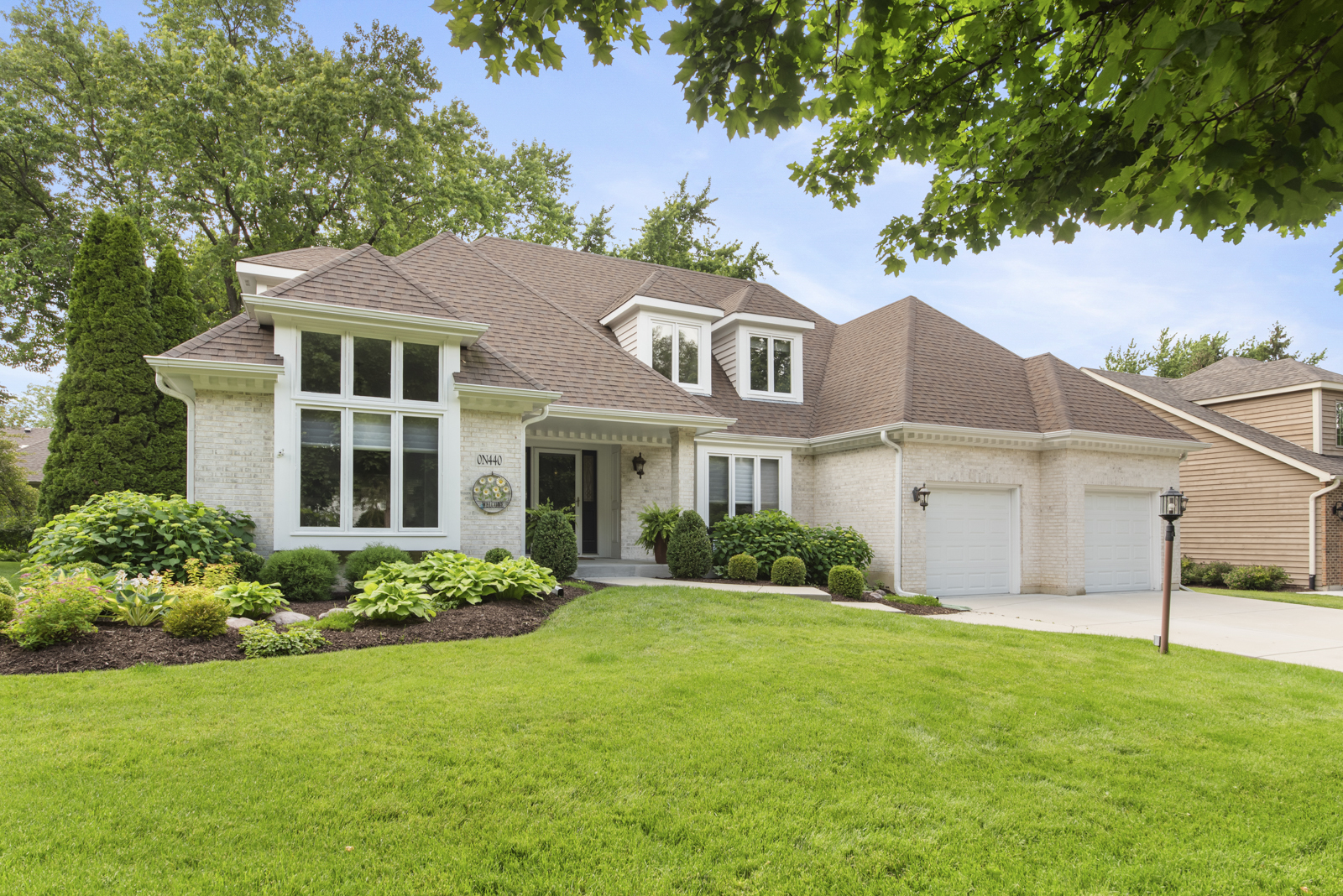 N440 Peter Road Winfield, IL 60190 - Photo 1 of 34 a front view of a house with a garden