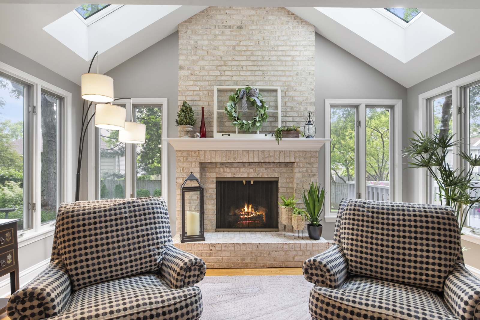 N440 Peter Road Winfield, IL 60190 - Photo 11 of 34 a living room with a fireplace windows and a dining table