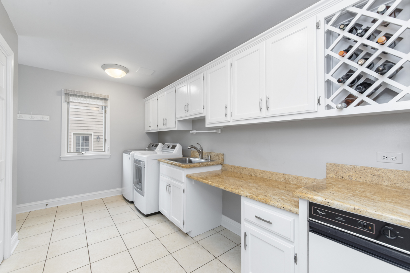 N440 Peter Road Winfield, IL 60190 - Photo 15 of 34 a kitchen with granite countertop white cabinets and white appliances