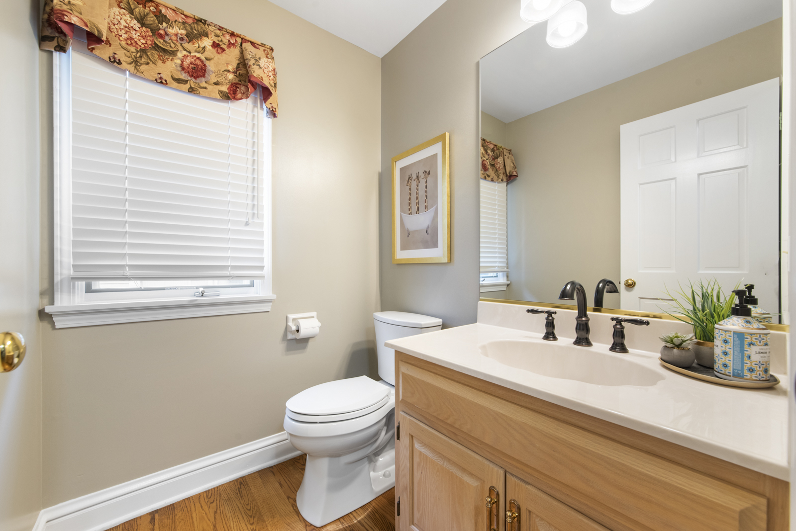N440 Peter Road Winfield, IL 60190 - Photo 8 of 34 a bathroom with a sink a toilet and mirror