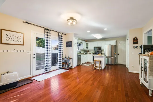 a bedroom with furniture and a wooden floor