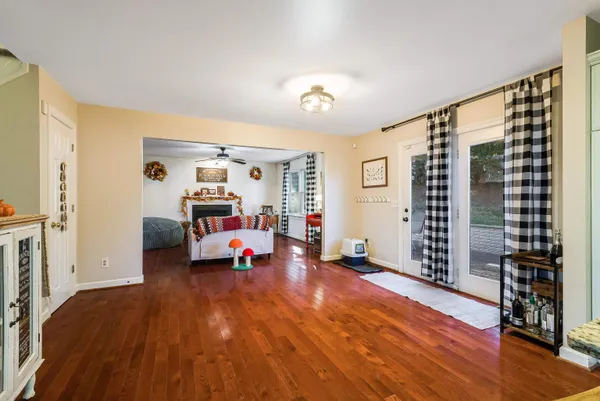 a bedroom with furniture and wooden floor
