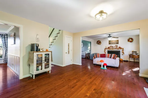 a kitchen with stainless steel appliances a refrigerator a stove a sink dishwasher and a refrigerator with wooden floor