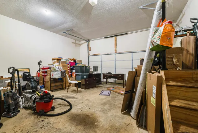 a view of walk in closet with clothes