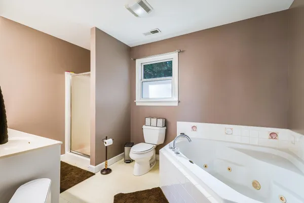 a bathroom with a sink vanity and a mirror