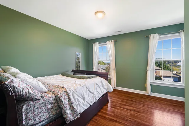 a bedroom with a bed and cabinets