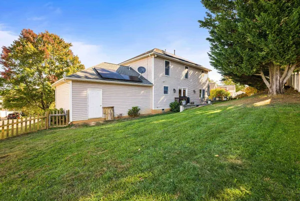 a front view of house with yard and outdoor seating