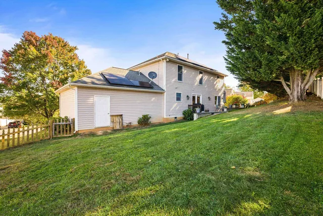 a front view of house with yard and outdoor seating