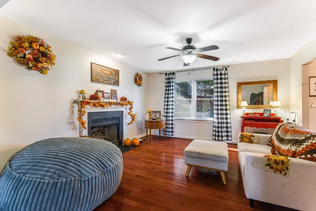 a living room with furniture and a fireplace