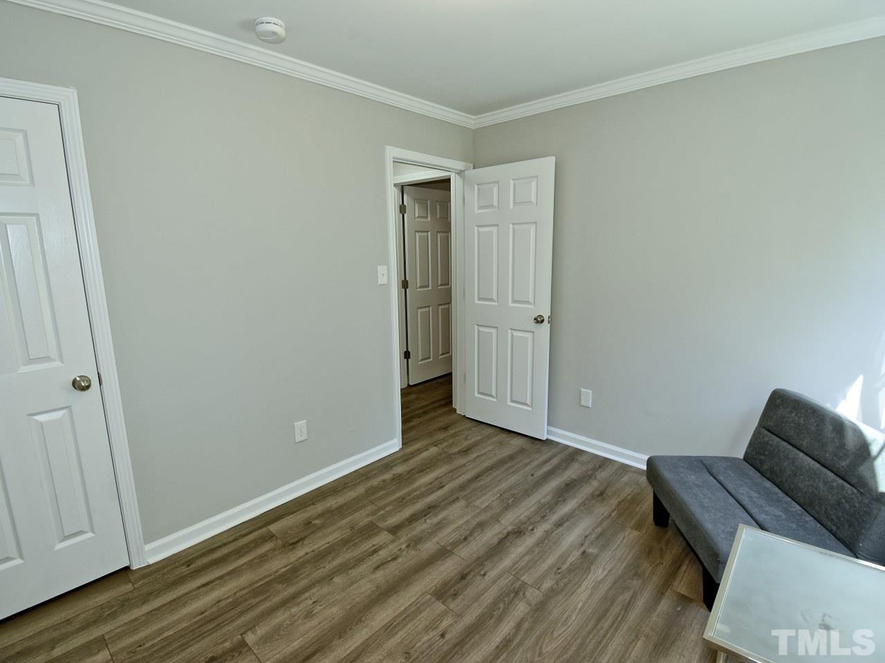 3606 Meriwether Drive Durham, NC 27704 - Photo 10 of 23 a view of room with wooden floor and couch