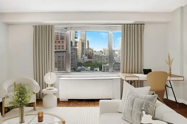 a spacious bedroom with two beds and a couch