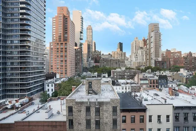 a room with a sink a washer and dryer