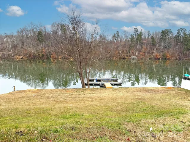 a view of a lake with houses in the back