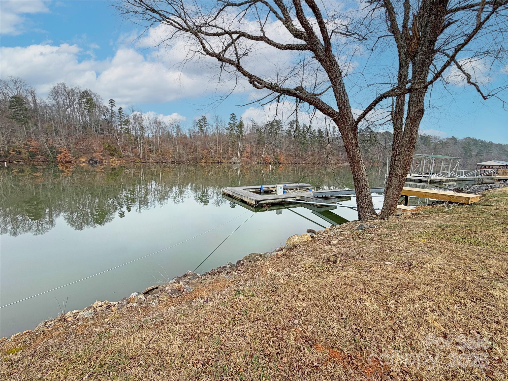 207 Catawba Avenue Hickory, NC 28601 - Photo 8 of 11 a backyard of a house with lots of green space and lake view