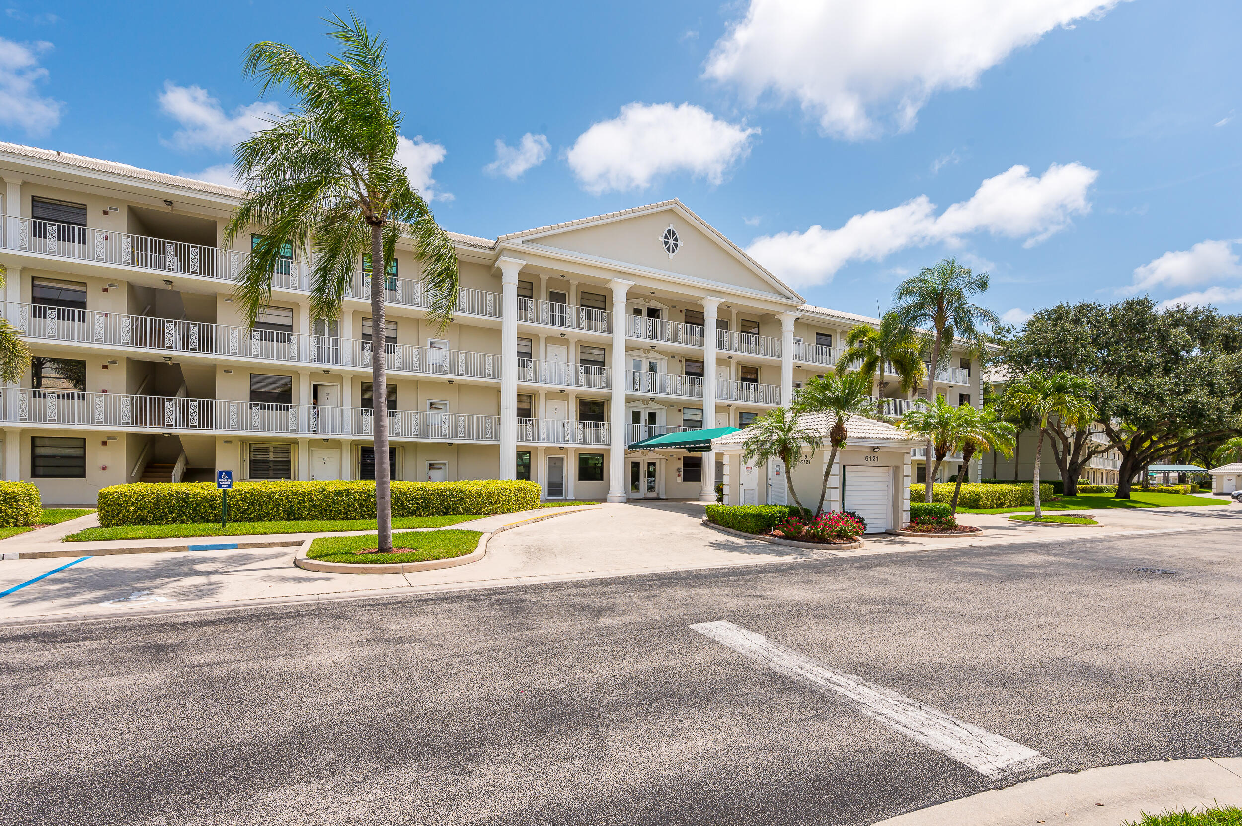 6121 Balboa Circle, Unit 202 Boca Raton, FL 33433 - Photo 1 of 17 a view of a building with a street