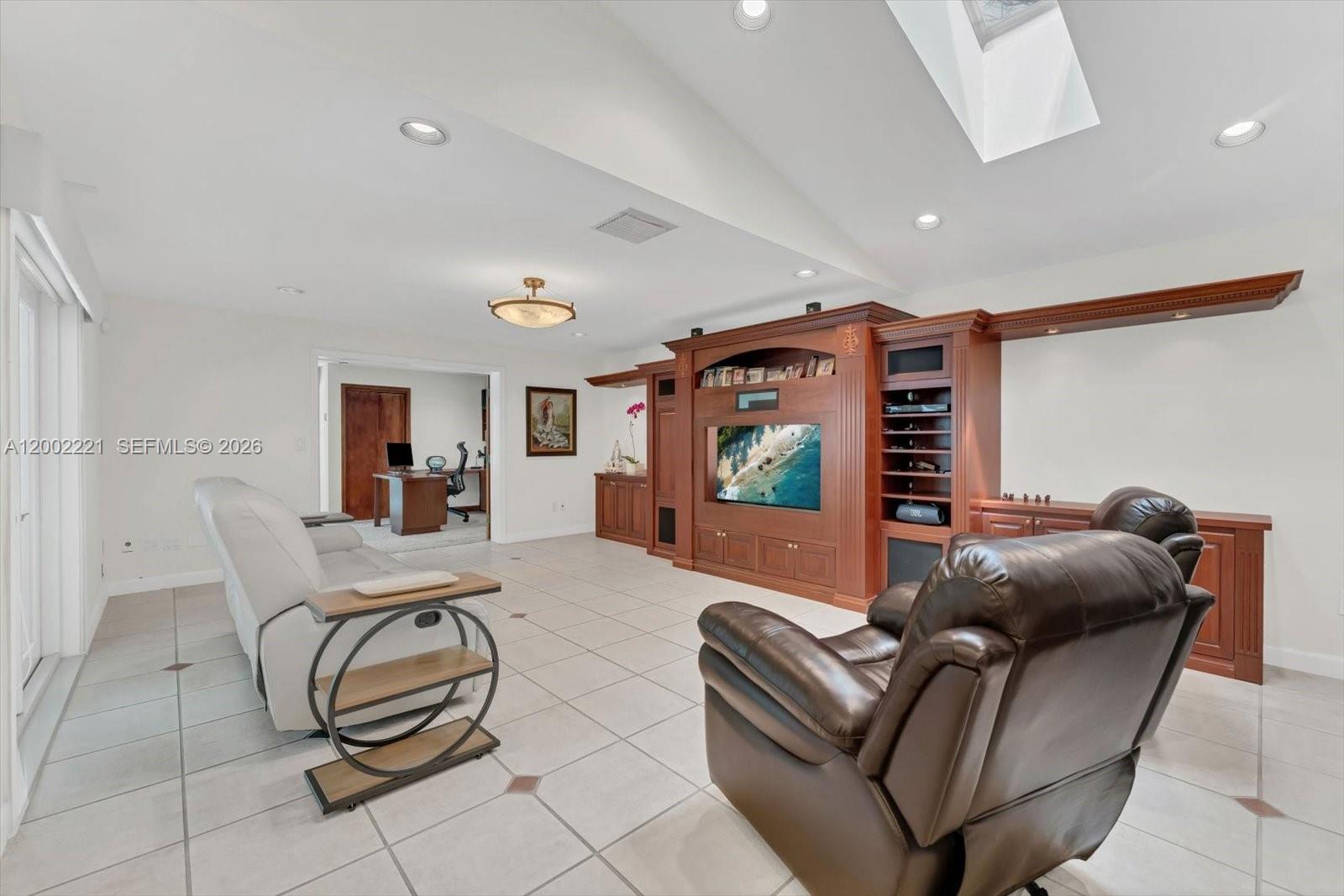 9941 Southwest 143rd Street Miami, FL 33176 - Photo 8 of 48 Family room with built-ins and skylights