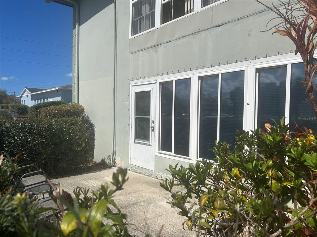 1433 South Belcher Road, Unit B7 Clearwater, FL 33764 - Photo 12 of 25 a front view of a house with a yard