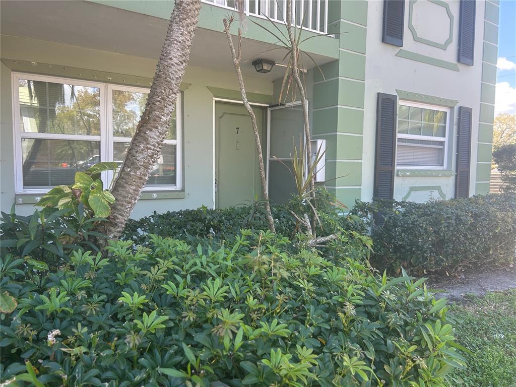 1433 South Belcher Road, Unit B7 Clearwater, FL 33764 - Photo 21 of 25 a view of a glass door with a yard