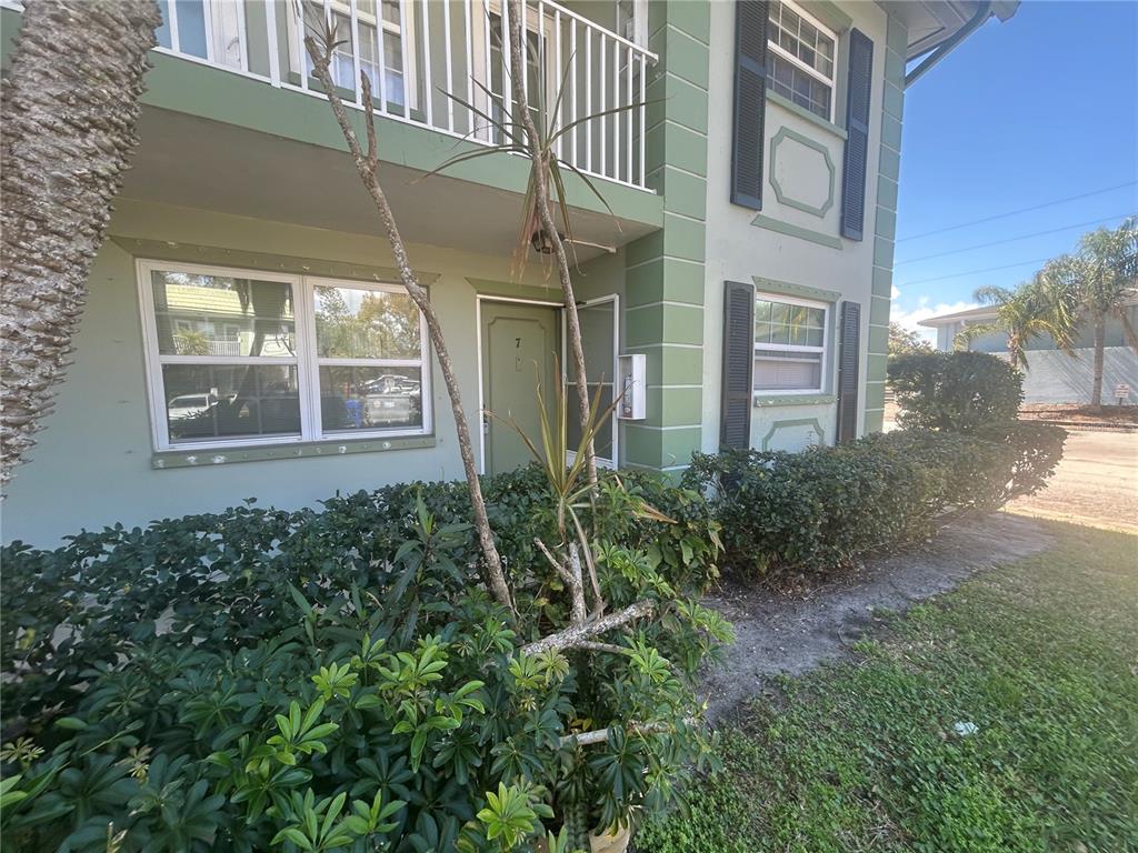 1433 South Belcher Road, Unit B7 Clearwater, FL 33764 - Photo 25 of 25 a view of a brick house many windows