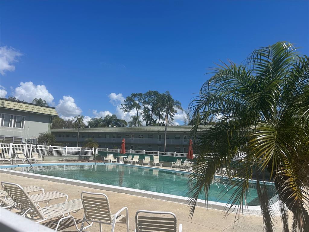 1433 South Belcher Road, Unit B7 Clearwater, FL 33764 - Photo 4 of 25 a view of swimming pool with lake view and mountain view