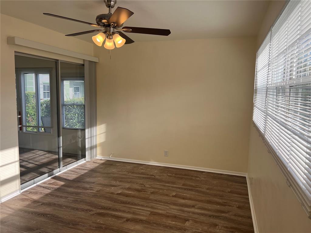 1433 South Belcher Road, Unit B7 Clearwater, FL 33764 - Photo 6 of 25 a view of room with window and wooden floor