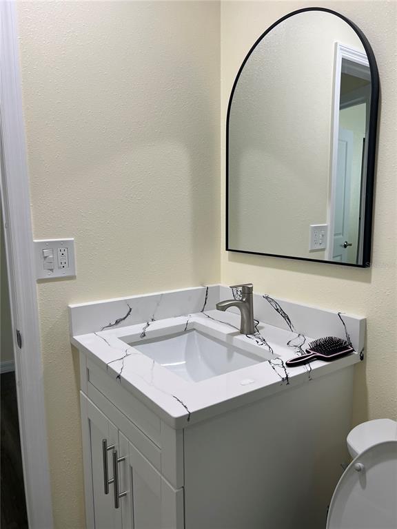 1433 South Belcher Road, Unit B7 Clearwater, FL 33764 - Photo 9 of 25 a bathroom with a sink and a mirror