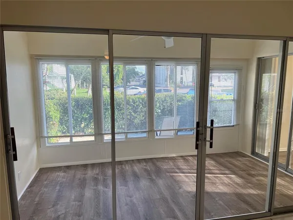 a terrace with outdoor seating and trees