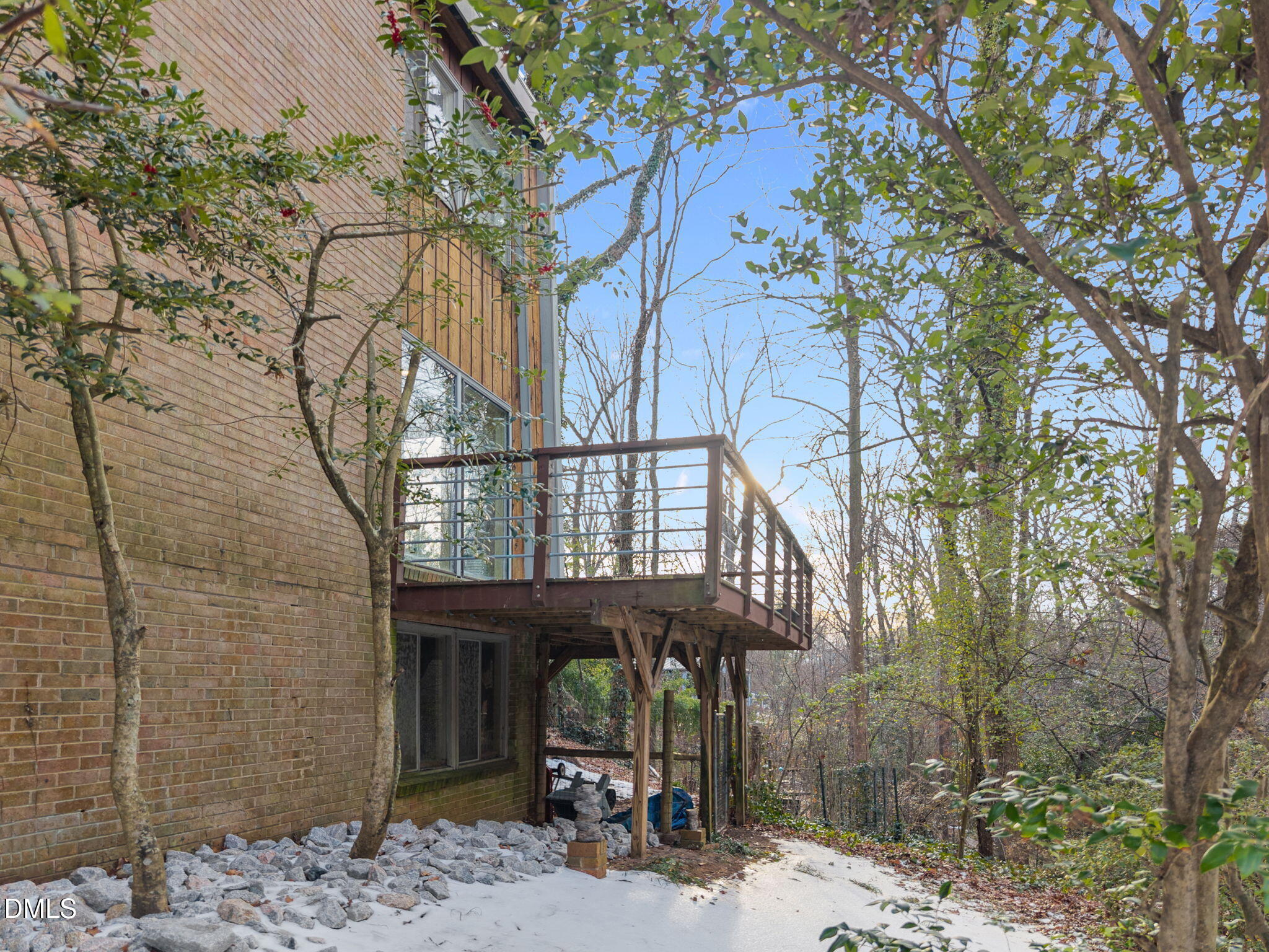 1108 Hemingway Drive Raleigh, NC 27609 - Photo 54 of 68 Spacious wrap-around deck overlooking the private wooded lot with a walk-in crawlspace below!