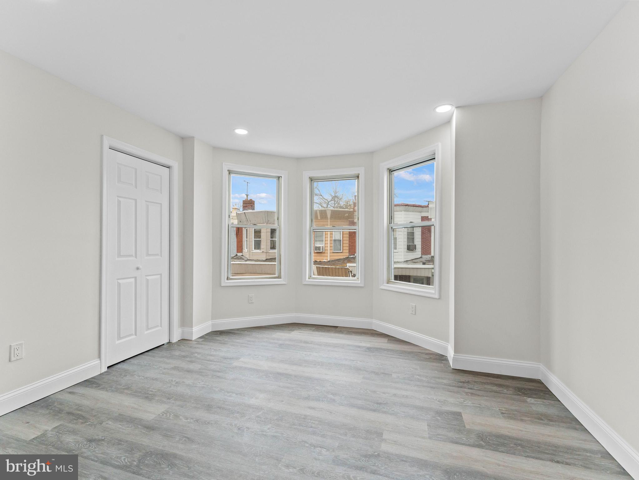 5422 Regent Street Philadelphia, PA 19143 - Photo 17 of 35 a view of an empty room with a window and wooden floor