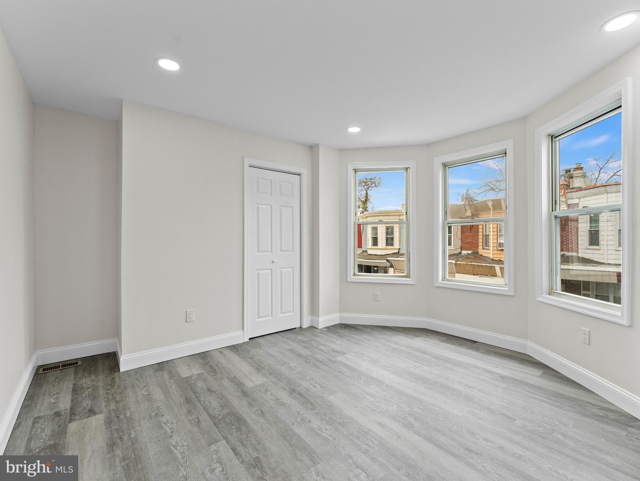 5422 Regent Street Philadelphia, PA 19143 - Photo 19 of 35 a view of an empty room with a window and wooden floor