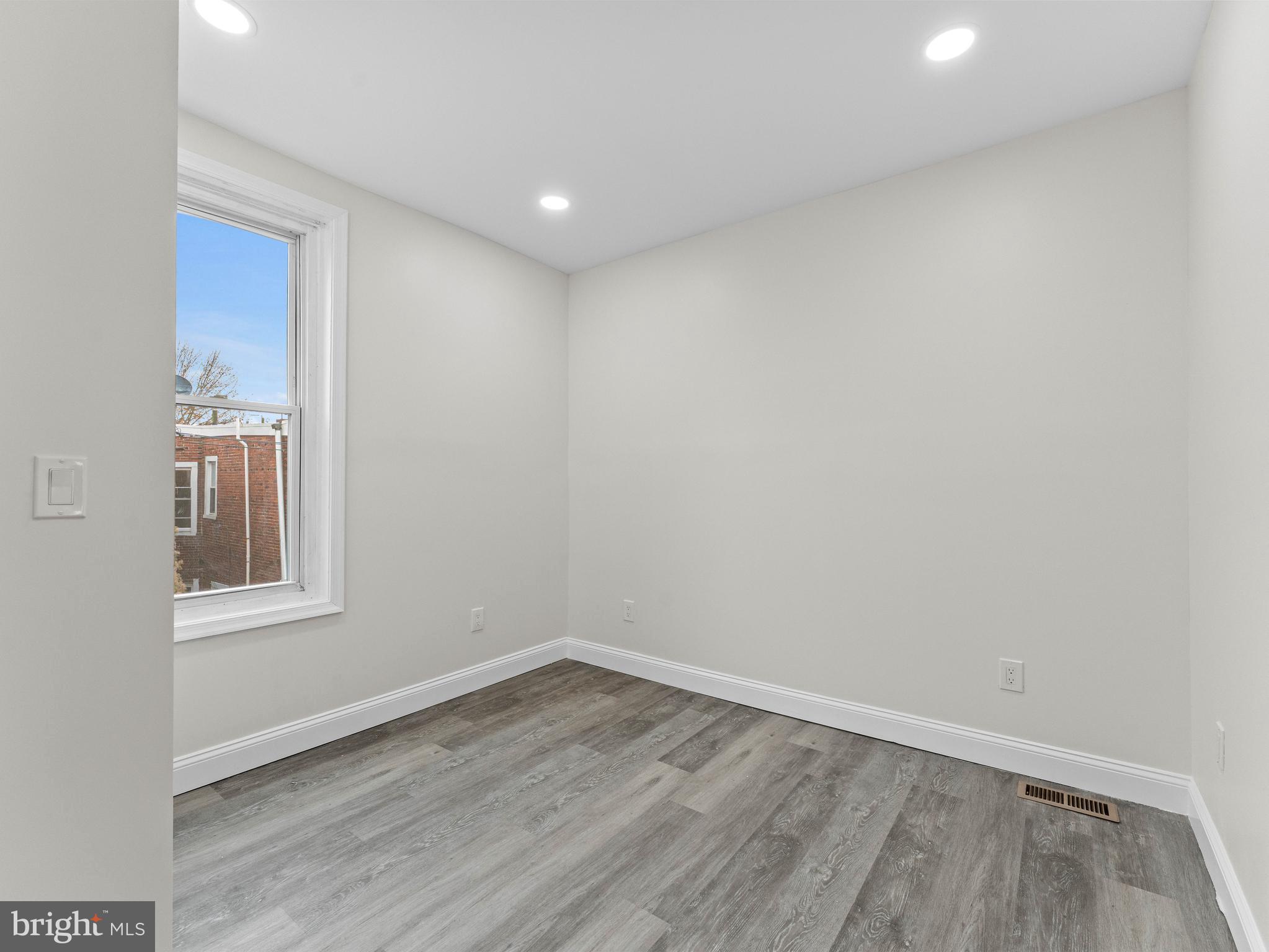 5422 Regent Street Philadelphia, PA 19143 - Photo 23 of 35 a view of empty room with wooden floor and fan