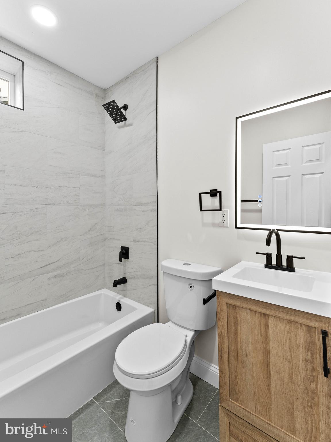 5422 Regent Street Philadelphia, PA 19143 - Photo 25 of 35 a bathroom with a sink toilet and shower