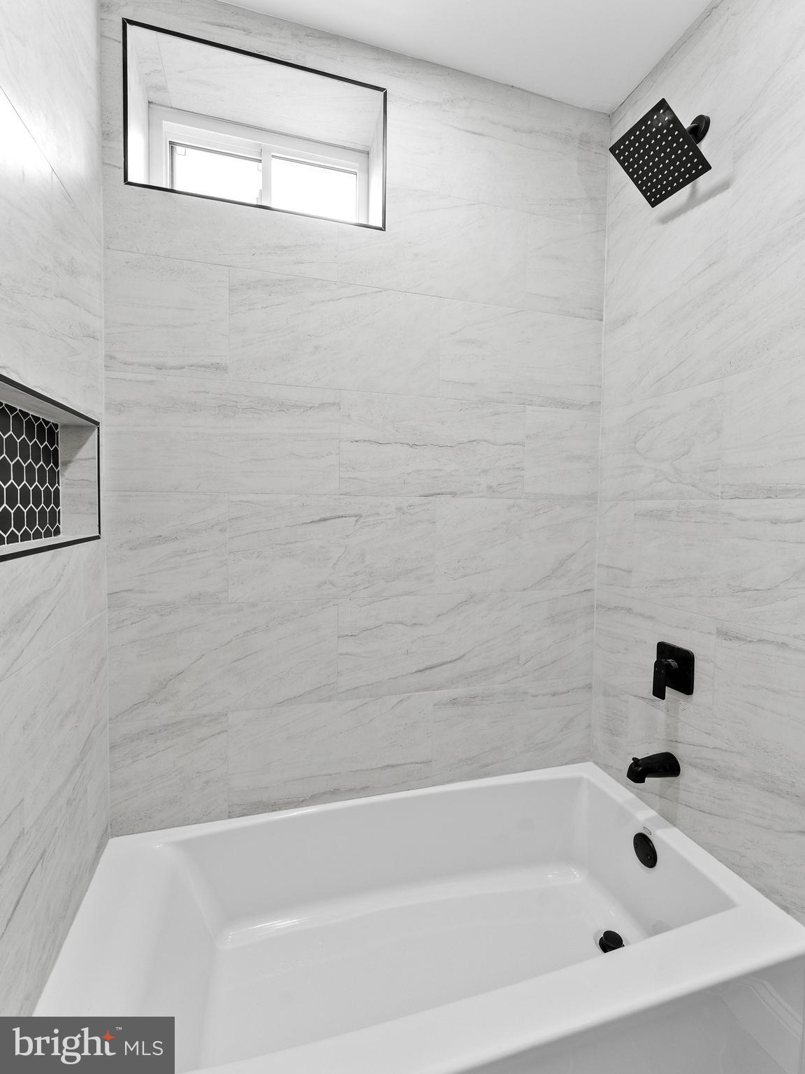 5422 Regent Street Philadelphia, PA 19143 - Photo 26 of 35 a bathroom with a bathtub