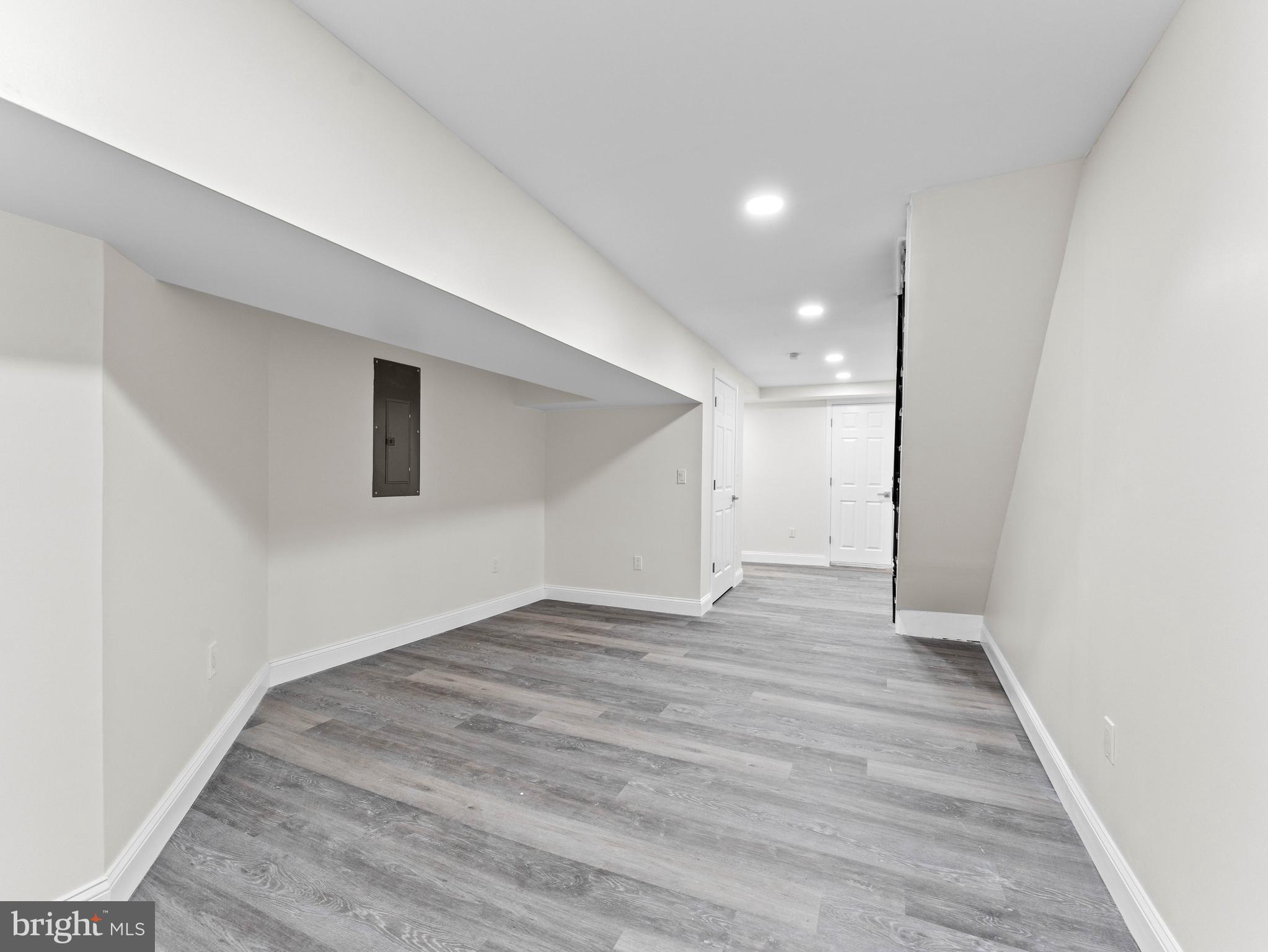 5422 Regent Street Philadelphia, PA 19143 - Photo 31 of 35 a view of an empty room with wooden floor