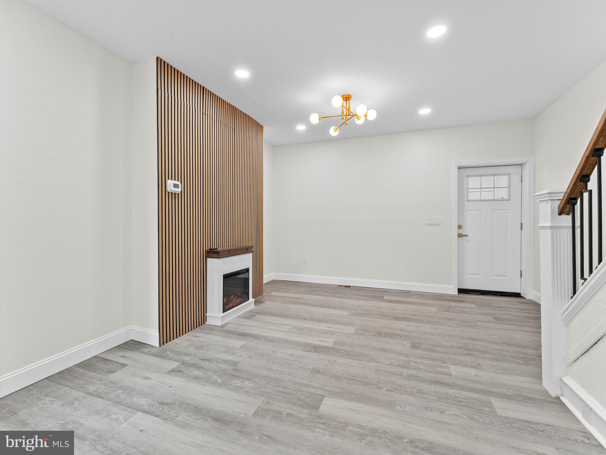 5422 Regent Street Philadelphia, PA 19143 - Photo 10 of 35 a view of an empty room with wooden floor and staircase