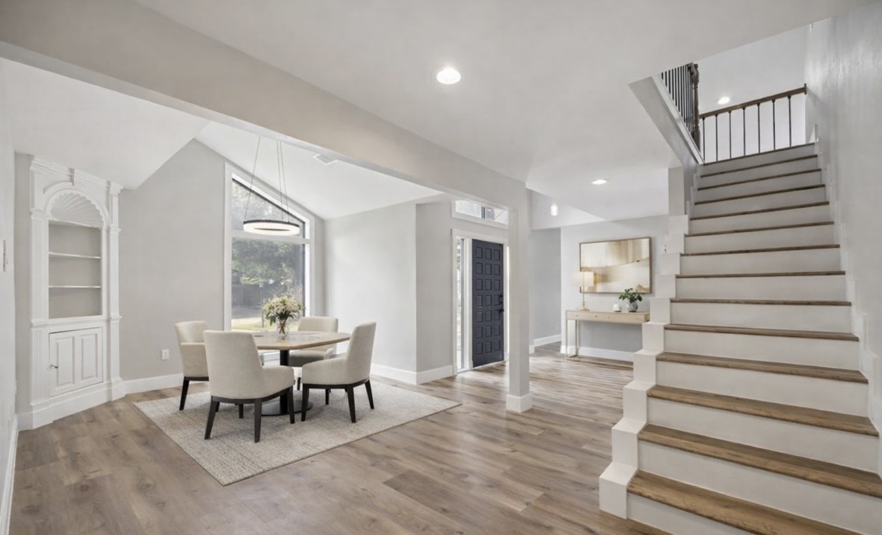 a dining room with furniture and wooden floor